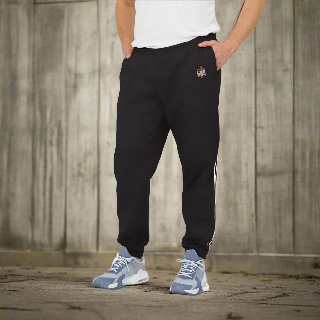 Authentic Adidas joggers customized by LMX Studio. Built Different sweatpants in Black, Navy, Dark Gray & Black. Premium streetwear, Adidas quality.